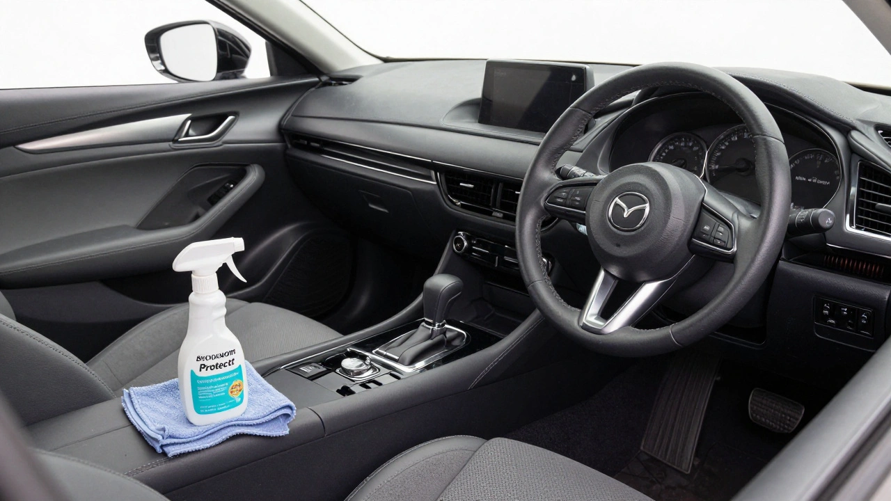 Nově vymalovaný šedý interiér auta Mazda s čistým vzhledem a ochranným sprejem na sedadle.